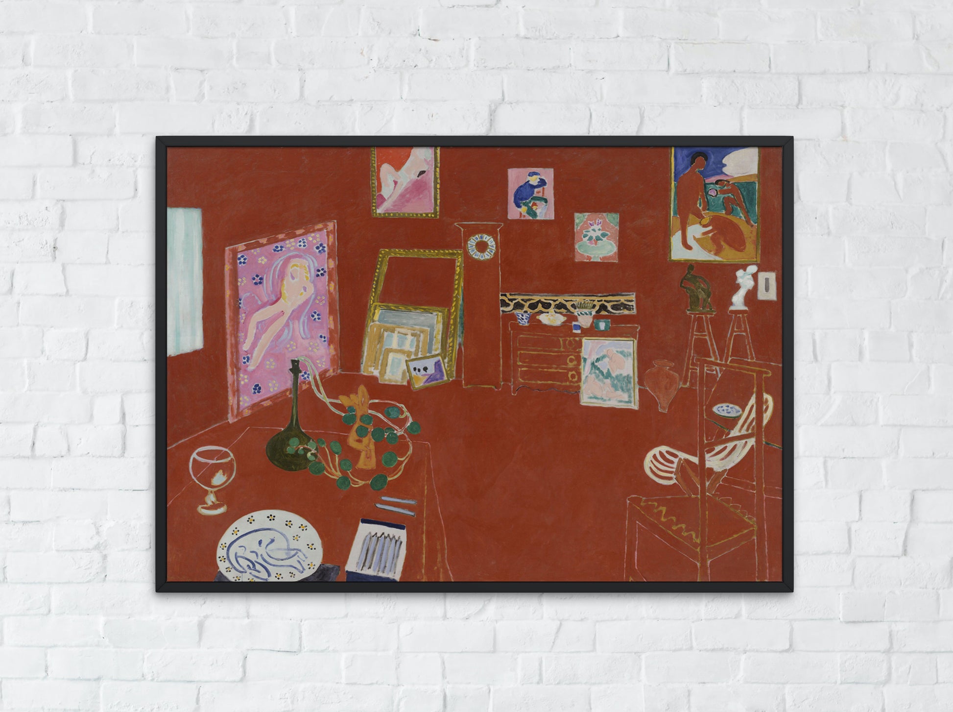 Henri Matisse The Red Studio Art Print Reproduction framed hanging on wall