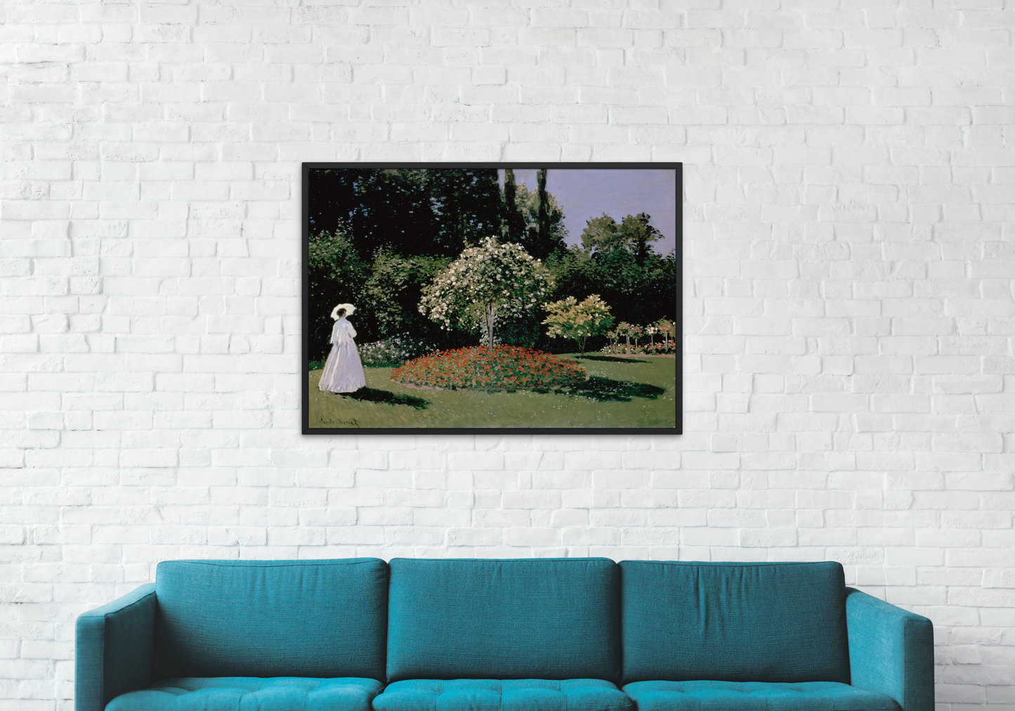 art print of woman in the garden by Monet hanging on wall next to couch