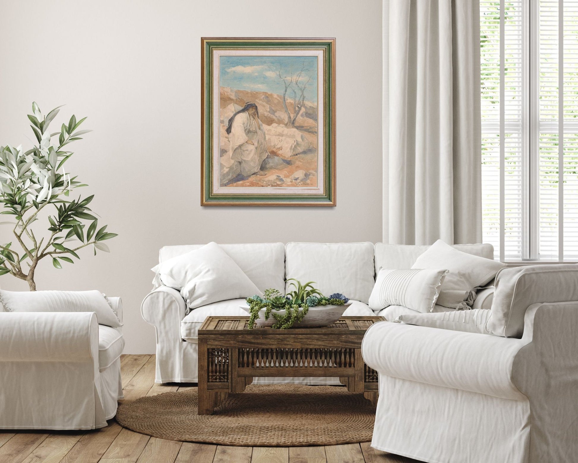 Seated Man in a Desert Painting by Juliaan De Vriendt Wall Art Print framed hanging on wall above white sofa